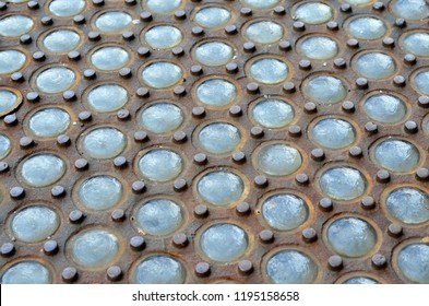 Closeup Of Vintage Vault Lights At The Base Of The Puck Building On Lafayette Street In Soho, NYC