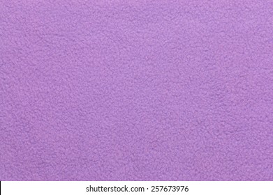 Closeup of violet plush or wool texture useful as background