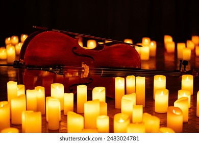 closeup of violin with lots of candles for design purpose 