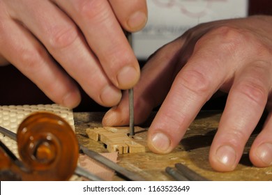 Closeup: Violin maker at work in Milan, Italy - Powered by Shutterstock