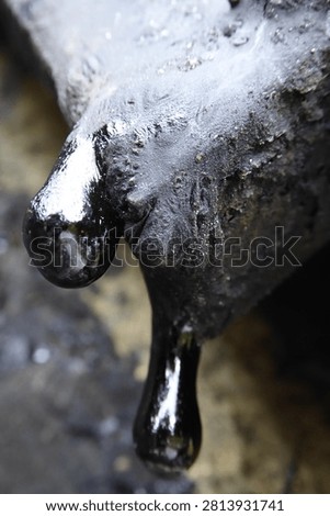 A close-up of viscous tar