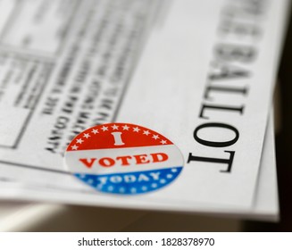 closeup of I voted sticker on a sample ballot