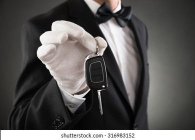 Close-up Of Waiter Holding Car Key In Hands
