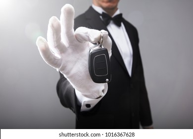 Close-up Of A Waiter's Hand Holding Car Key