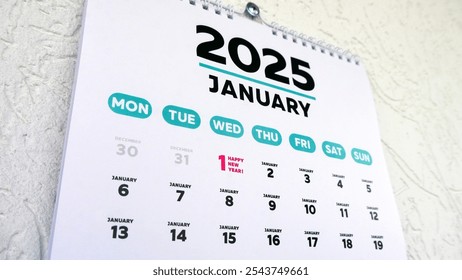 Close-up of a wall calendar January page with the marked date of New Year 2025 - Powered by Shutterstock