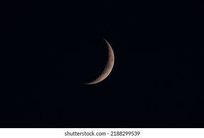 A Close-up Of A Waning Crescent Moon