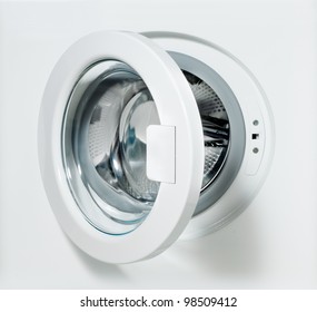 Closeup Of Washing Machine Door With Empty Drum