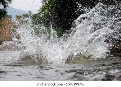 Close-up Of Water Huge Splashing In Pond From People Falling Into Water, Abstract Art Picture For Background