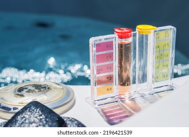 Closeup of Water Quality Manual Test Kit with Color Scale for PH and Chlorine Level. Residential Swimming Pool Care, Treatment and Testing Routine. - Shutterstock ID 2196421539