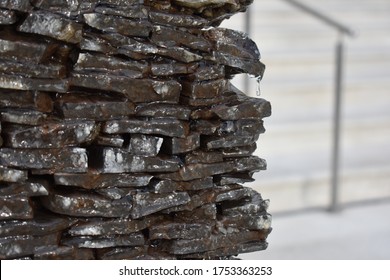 Closeup Of Water Running Down Rocks Wall