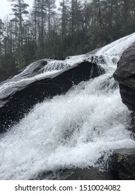 Closeup of a Waterfall with Rocks and Trees