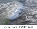 close-up of waves on the Channel coast in Normandy, France, with low shutterspeed