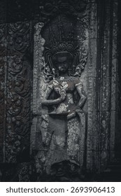 Close-up of a Weathered Stone Devata or Apsara Carving on the Thommanon Temple Wall