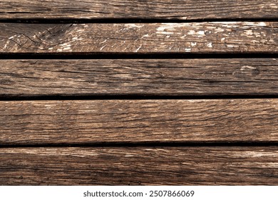 Close-up of weathered wooden planks. A detailed close-up of weathered wooden planks shows the rich texture and natural patterns of aged wood. - Powered by Shutterstock