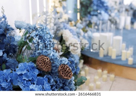 Close-up wedding decor of blue hydrangea flowers and white roses