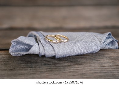 Close-up Wedding Rings On Pocket Square