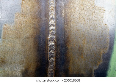 The closeup of a weld on a steel pipe for a gas line / Weld