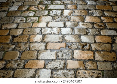 closeup of wet cobblestone in a medieval village - Powered by Shutterstock