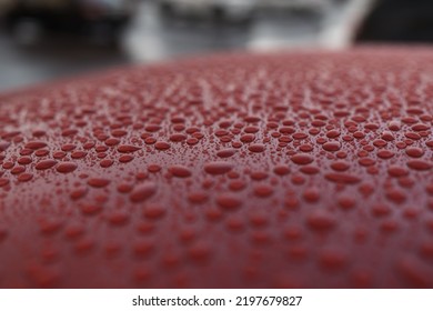 Closeup Wet Red Car Paint Surface With Hydrophobic Ceramic Coating, Shallow Focus