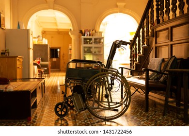 Closeup Of Wheel Chair Parking In Sino Portuguese House With Morning Sunlight In Background.
Wheel Chair,side View.