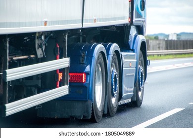 A Closeup Of Wheels In Motion From An Articulated Lorry, Traveling Along A UK Motorway.