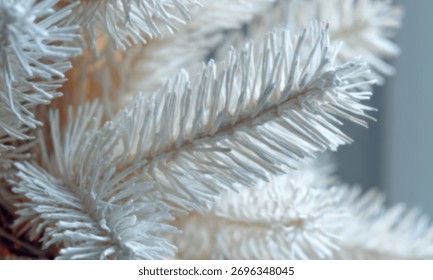 Close-up of white artificial tree branches, showcasing intricate texture and details that enhance the festive mood.