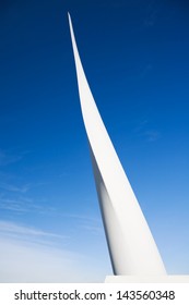 Closeup Of White Blade Of Wind Turbine Against Blue Sky