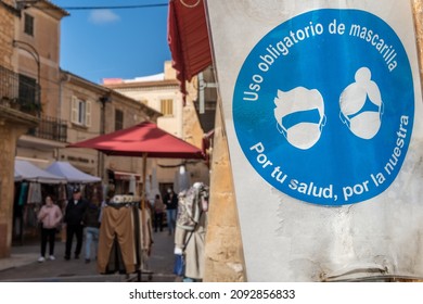 Close-up Of A White And Blue Sign That Says In Spanish Language: 