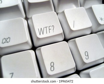 Close-up of a white computer keyboard with the acronym "WTF' superimposed onto a key