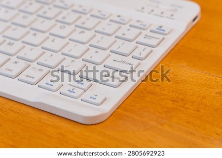 Closeup of white computer keyboard with focus on Shift key