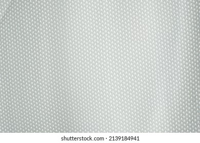 Close-up Of White Mesh Polyester Fabric. White Sports Jersey Shirts Background.