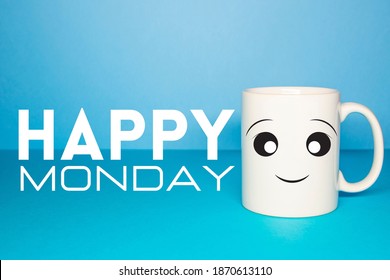 Close-up Of A White Mug On A Blue Background. Happy Monday Concept.