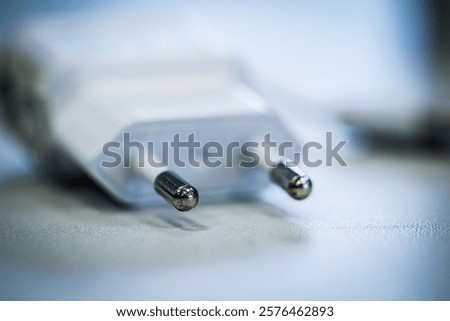 Close-up of a white power plug