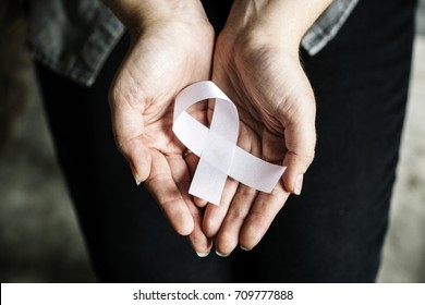 Closeup Of White Ribbon On Hands Palm Bone Cancer Anti Violence Awareness