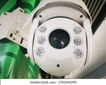 Closeup Of White Surveillance Camera With Lights