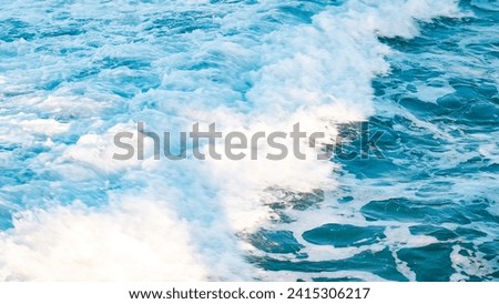 Close-up of white water rushing towards the shore