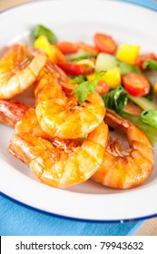 Closeup Of Whole Fried Jumbo Shrimp With Sauteed Vegetables