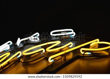 Close-up of whtie and yellow neon tubes