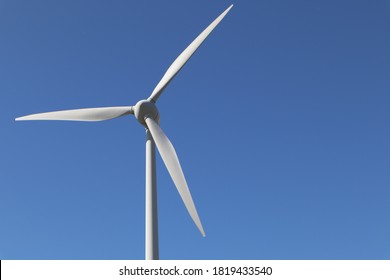 Close-up of a windmill for renewable energy generation with copyspace.