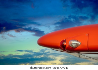 Close-up Of A Wingtip With Landing Lights Against A Picturesque Sky As A Concept For General Aviation And Pilot Training.