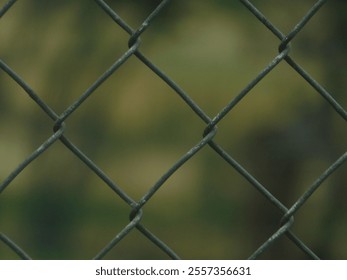 closeup of wire fence with blurred background - Powered by Shutterstock