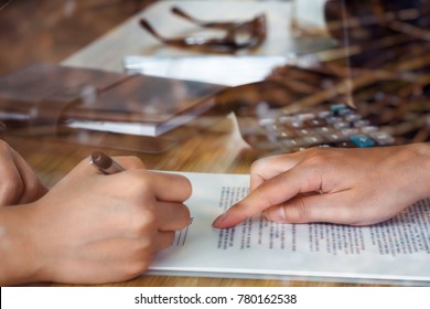 Closeup Of Woman Applicant Writing In Resume Form, Person Completing Filling Information And Executive Pointing Help Her To Sign In Application Form, Hiring Concept.