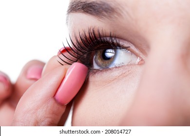 Close-up Of A Woman Applying False Eyelashes