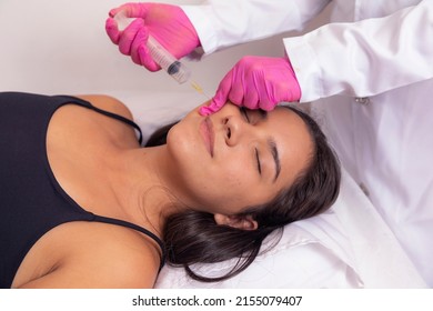 Closeup Of Woman Applying Ozone To Her Face For Cosmetic Treatment.