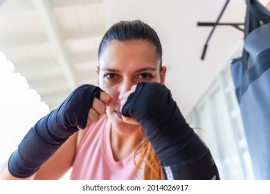 Close-up Of A Woman In Boxing Pose Looking At The Camera