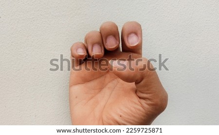Closeup of woman cutted her nails after treatment, isolated on white background. Clean cutting long nails, there are dark, rough skin and concept to keep clean nail care illustration for their healthy