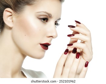 Closeup Of A Woman With Dark Red Lips And Nails. 