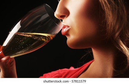 Close-up Of Woman Drinking Champagne