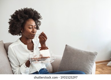 Closeup of woman eating cake. Beautiful girl enjoys eating a cake with chocolate. Pretty young woman eats a sweet cake. food, junk-food, culinary, baking and holidays concept.  - Powered by Shutterstock