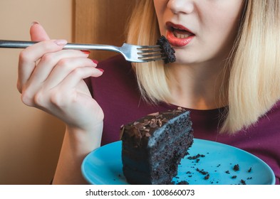 Closeup Of Woman Eating Chocolate Cake. Blue Plate With Cake. Diet Concept